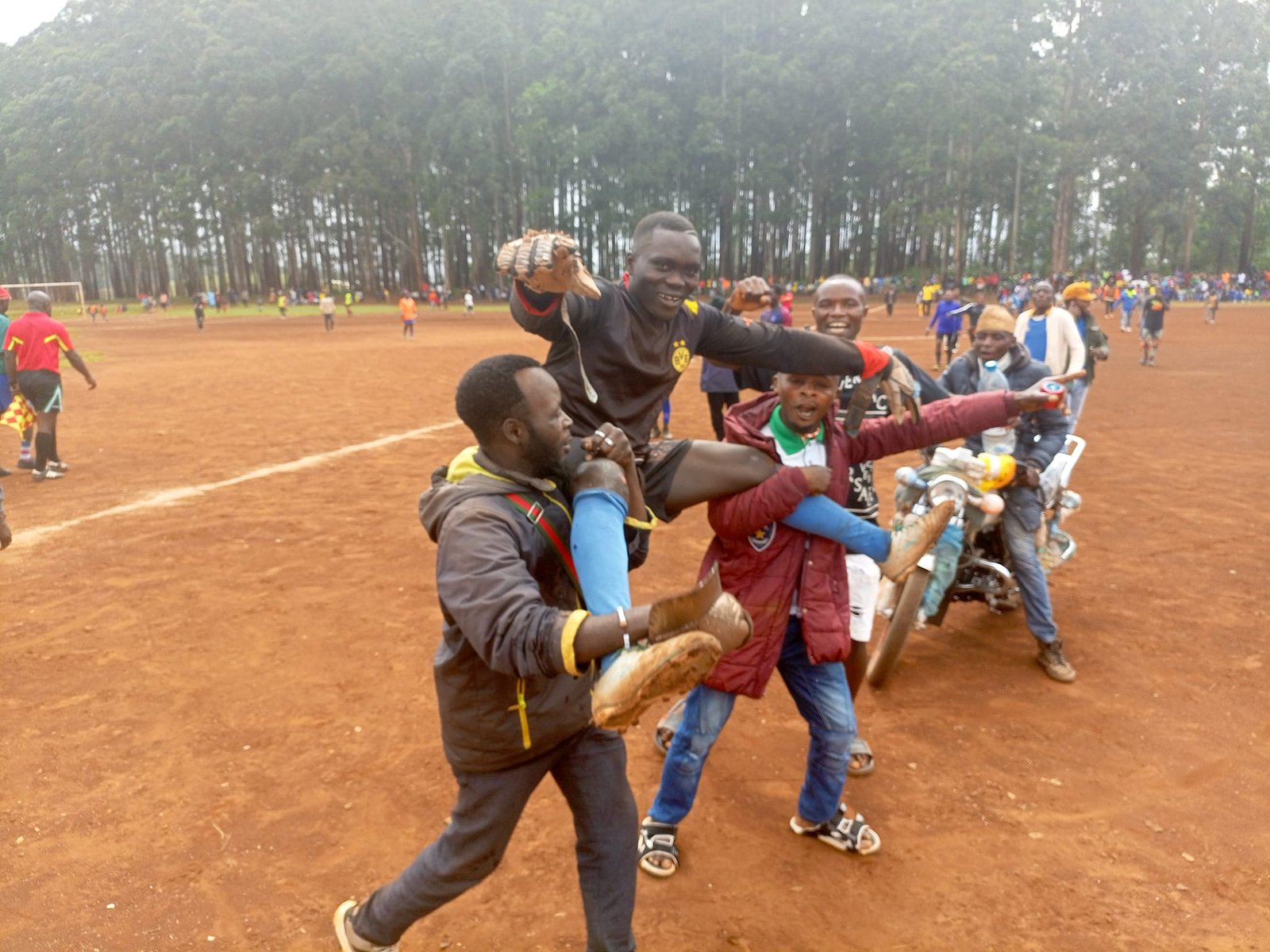 Fans carry goalkeeper at end of match at the Nkambe Municipal stadium (Photo by Fai Gideon Sport)